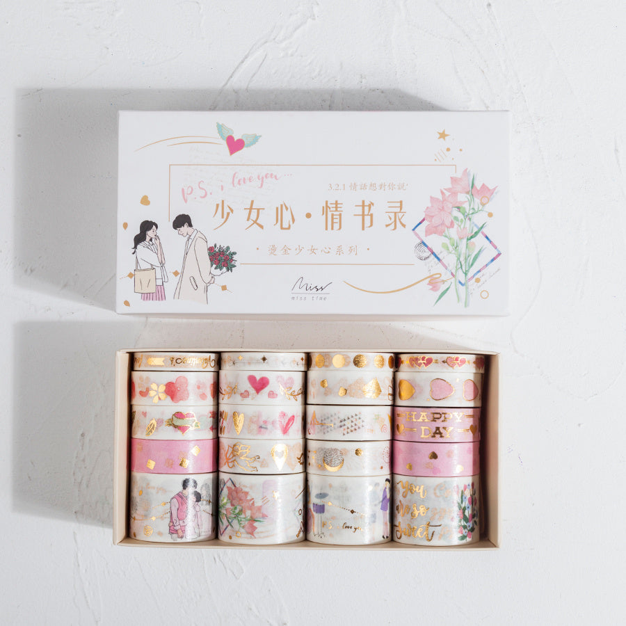 Set of washi tapes in a decorative box with illustrations and text on a light gray background