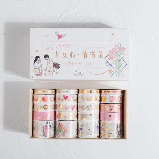 Set of washi tapes in a decorative box with illustrations and text on a light gray background