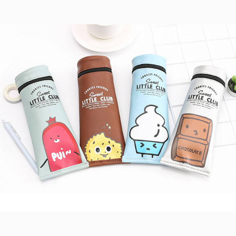 Four colorful Toothpaste bottles with cartoon designs on a white surface