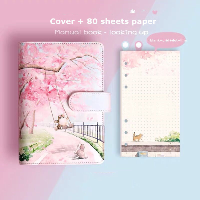 Notebook cover with cherry blossom design and 80 sheets of paper on a pink and blue gradient background.