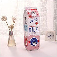 Carton of strawberry milk Pencil Case on a white surface with decorative items in the background