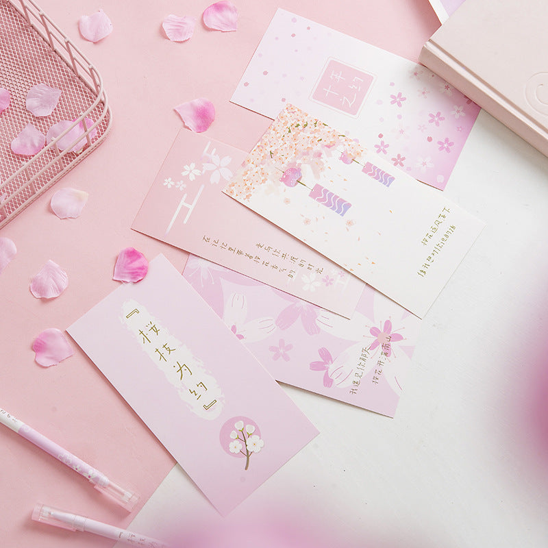 Set of pink envelopes with floral designs on a pink background