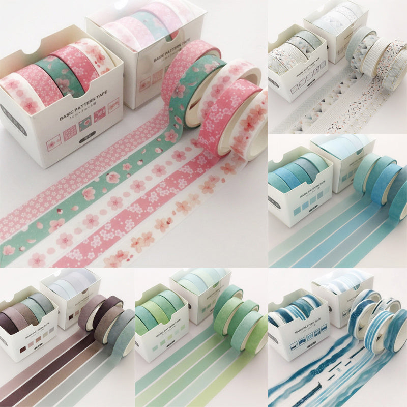 Set of decorative tape rolls with floral and striped patterns on a white background.