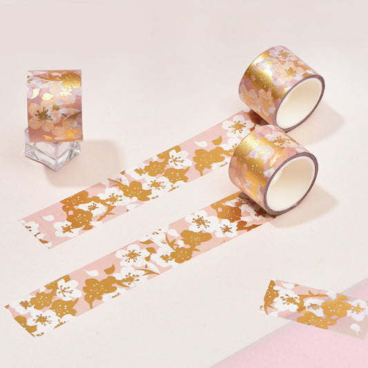 Decorative tape with floral pattern on a light pink background