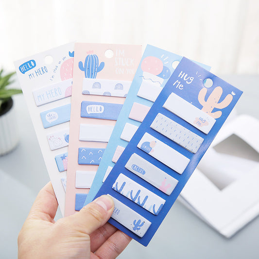 Set of colorful  notes with cactus and text designs held by a hand.