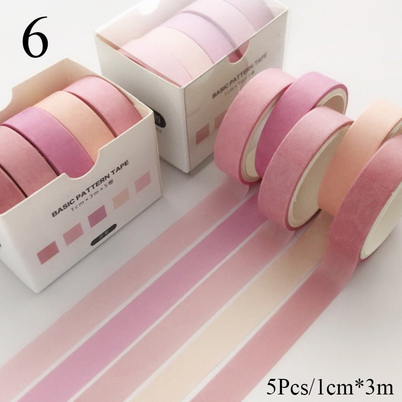 Set of pink patterned tapes with packaging on a white background