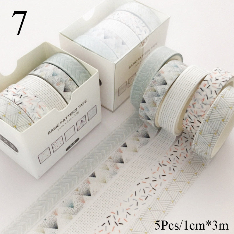 Set of patterned tape rolls with a box on a light background