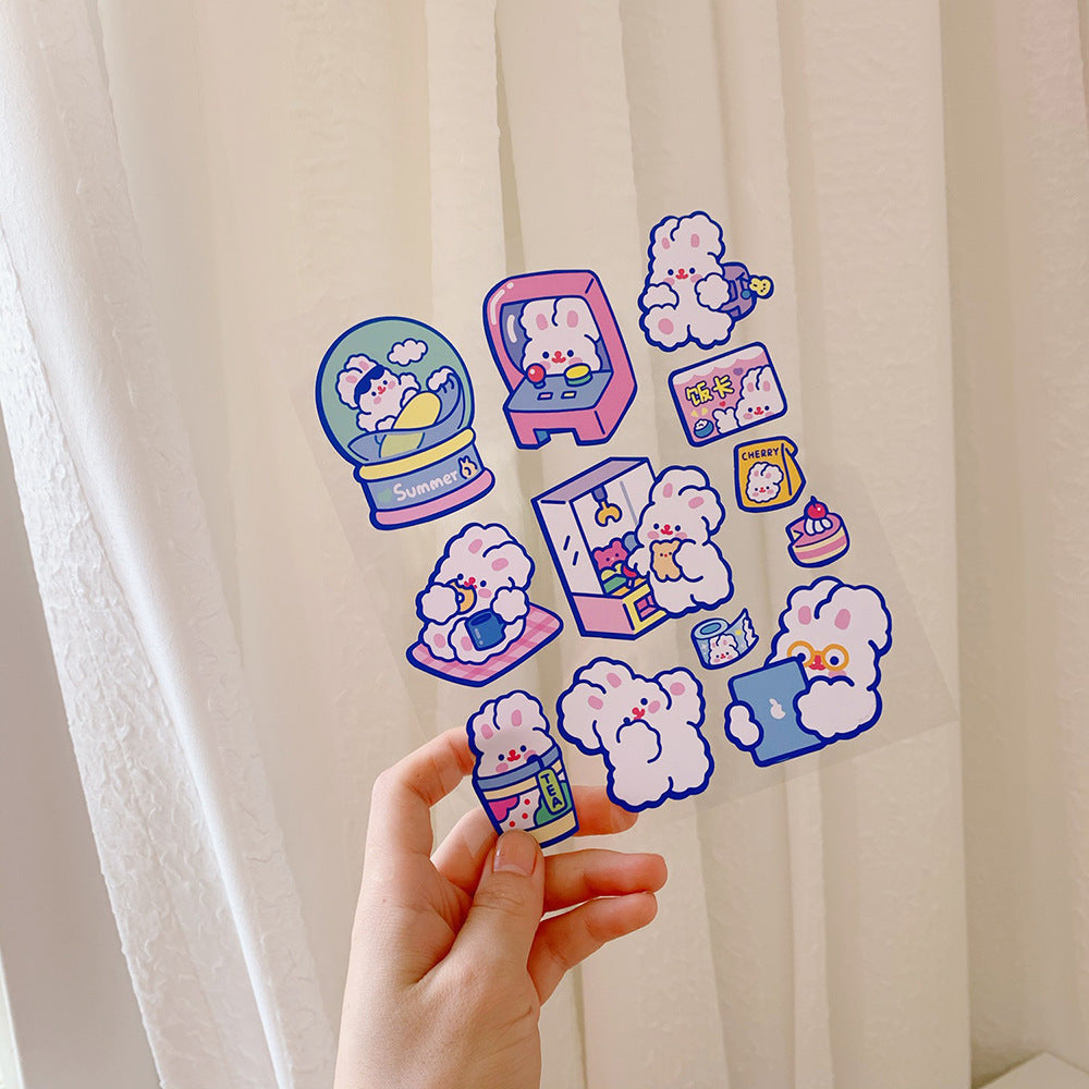 Hand holding colorful cartoon-style phone stickers against a white curtain background