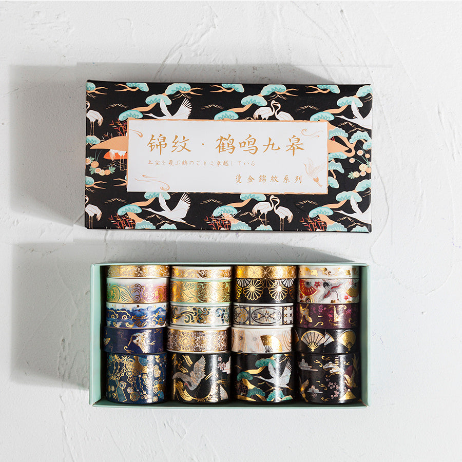 Set of washi tape rolls in a decorative box with a crane design on the lid.