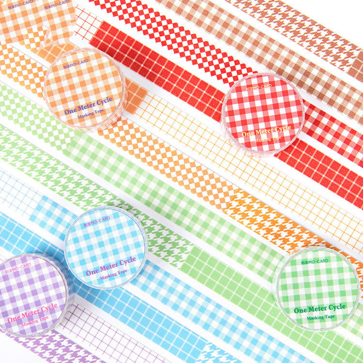 Set of colorful washi tape rolls with checkered and grid patterns.