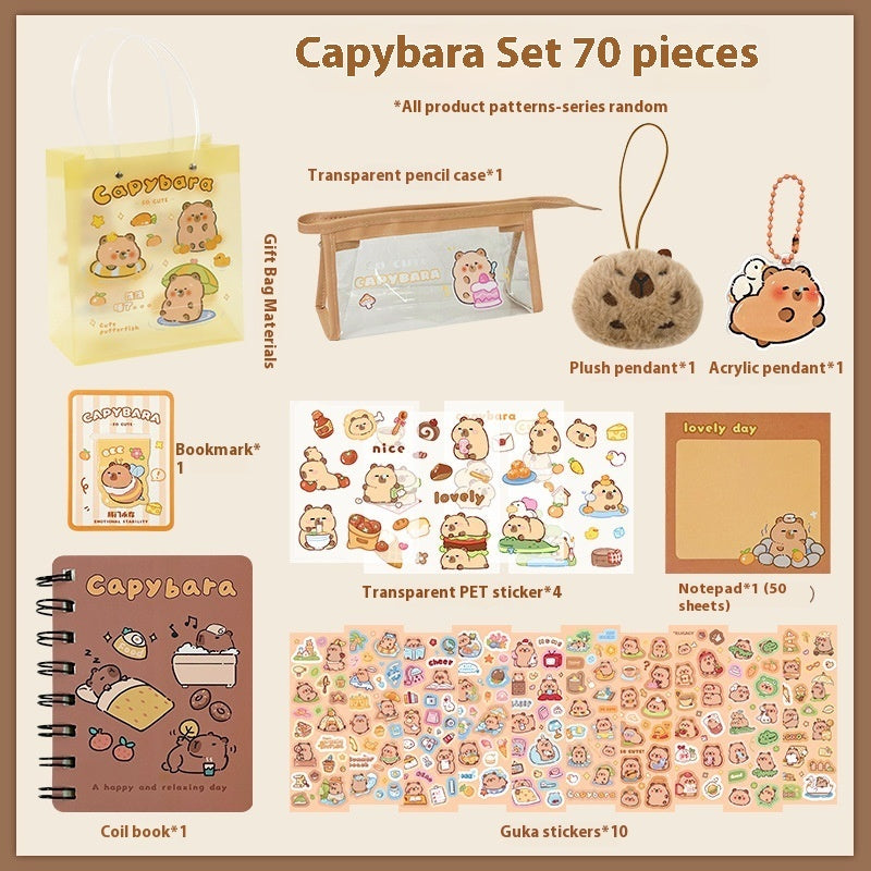 Capybara-themed 70 Piece stationery set with various items on a beige background