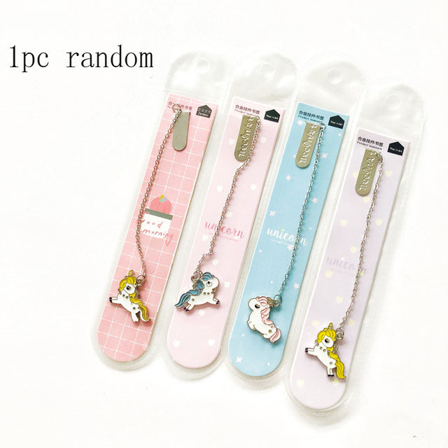 Four colorful bookmarks with unicorn designs in their packaging on a white background.