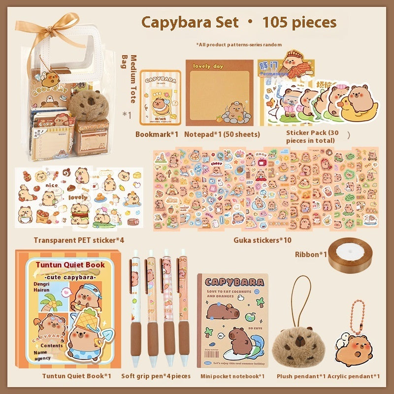 Capybara-themed stationery set with various items on a beige background