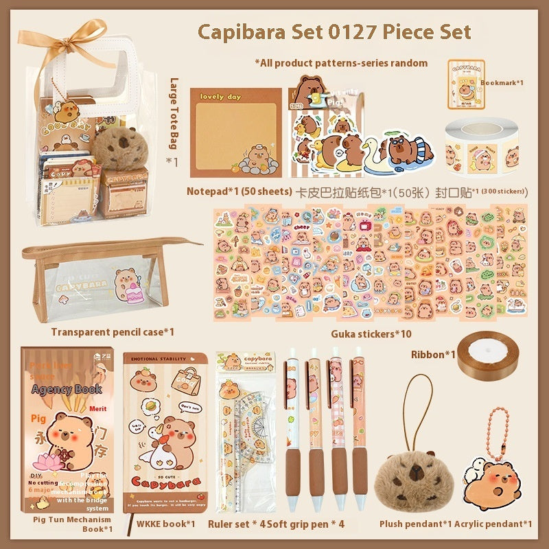 Capibara-themed stationery set with various items on a beige background