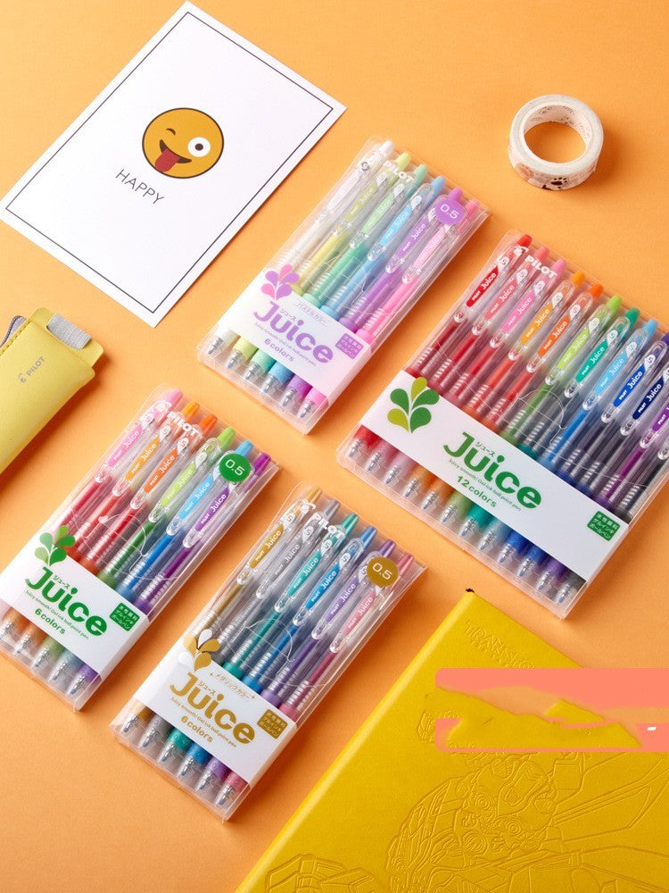 Juice pastel gel pens in packaging on an orange background