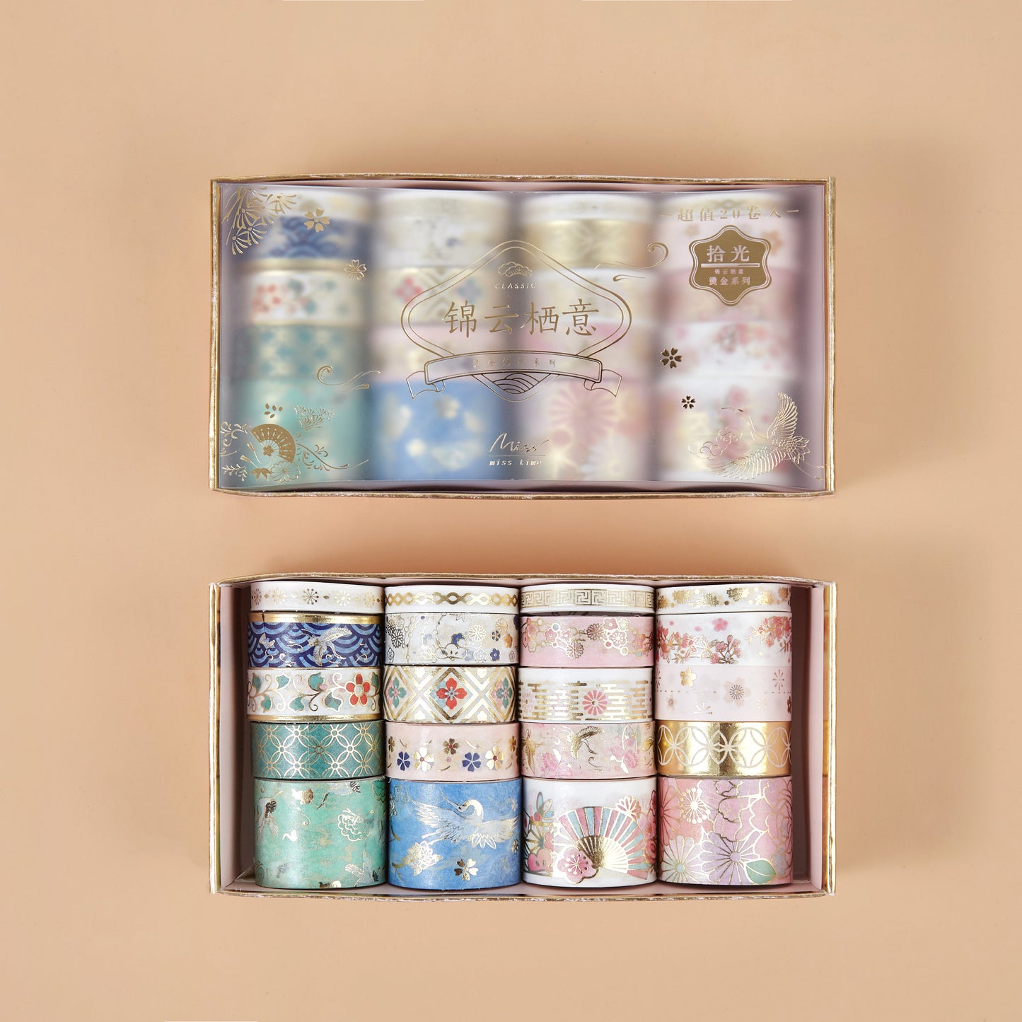 Set of decorative washi tape rolls in a box on a beige background